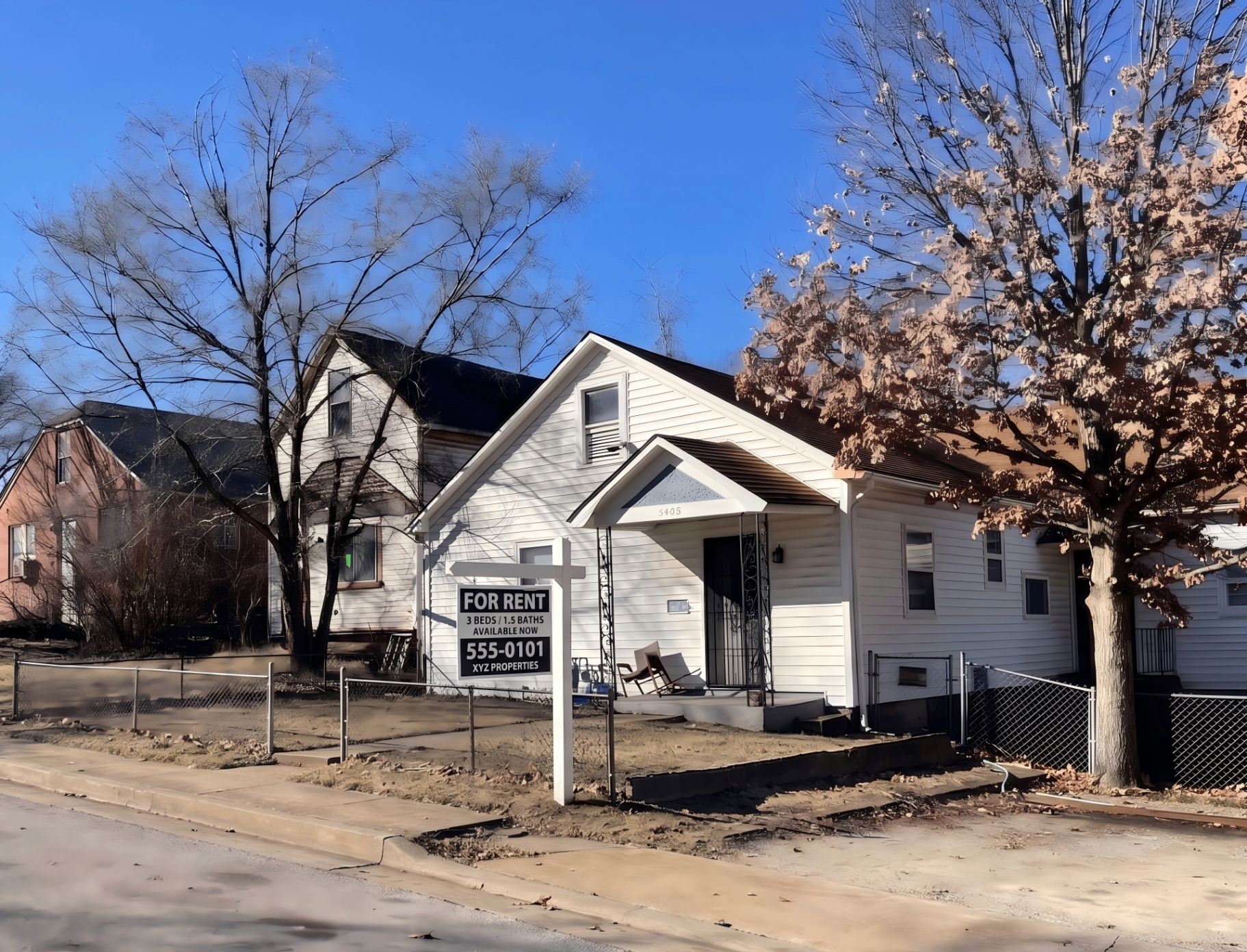 Same rental home cleaned up, curb cleared and ready to rent with a For Rent sign in the yard